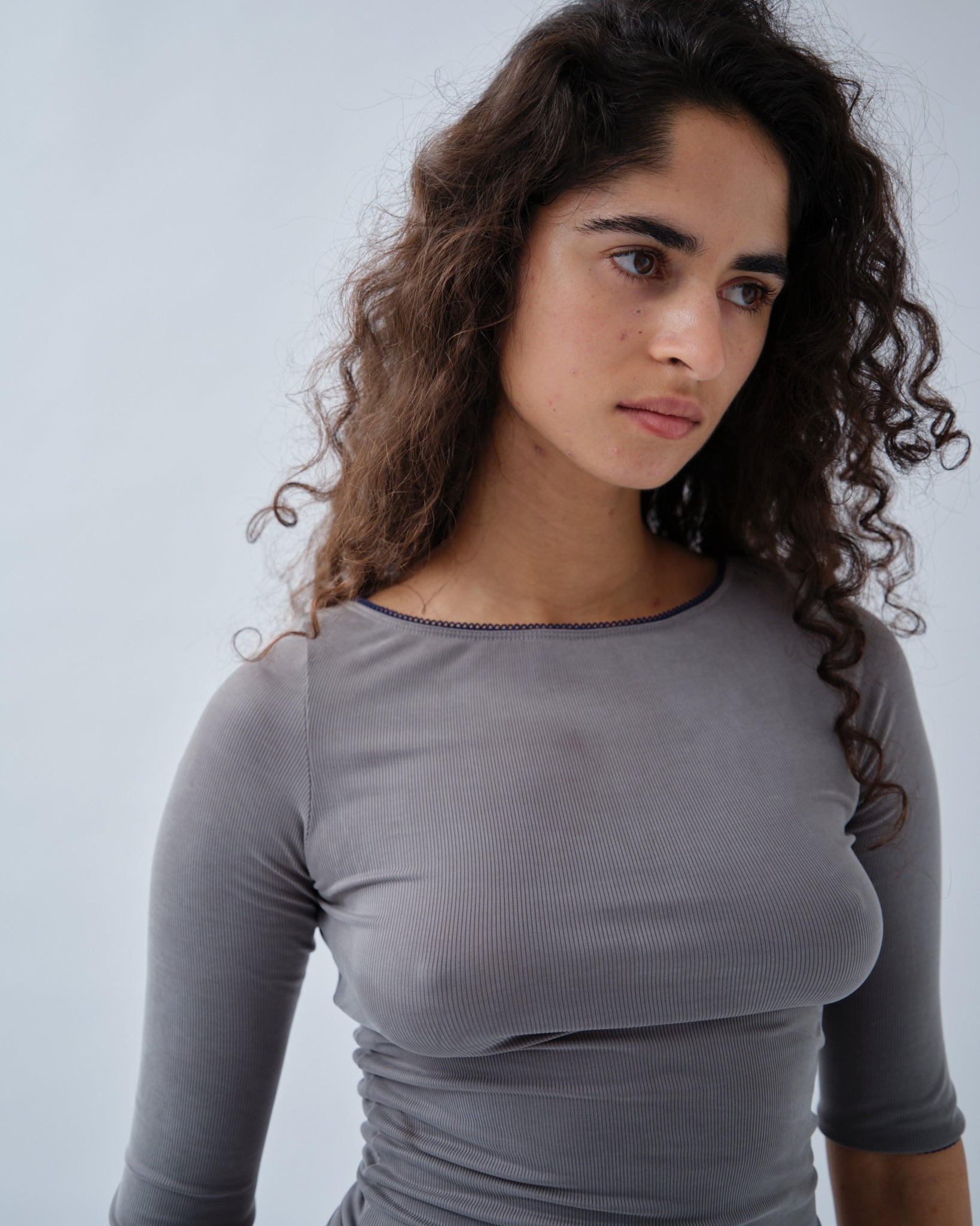 Women wearing ribbed grey 3/4 sleeve boatneck
